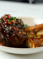 Pomegranate Glazed American Lamb Shank with Creamed Kale and Garlic Confit Potatoes