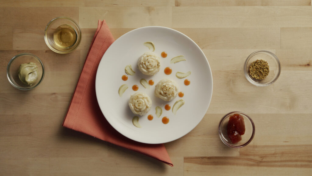 A plate of pudding shaped like roses