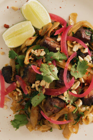 Plated dish of vibrant pad see ew, shot from above