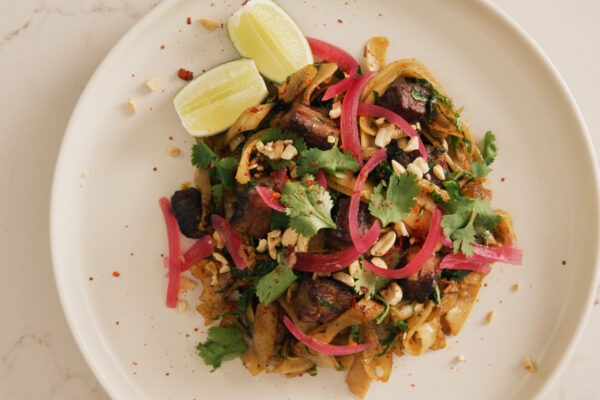 Plated dish of vibrant pad see ew, shot from above