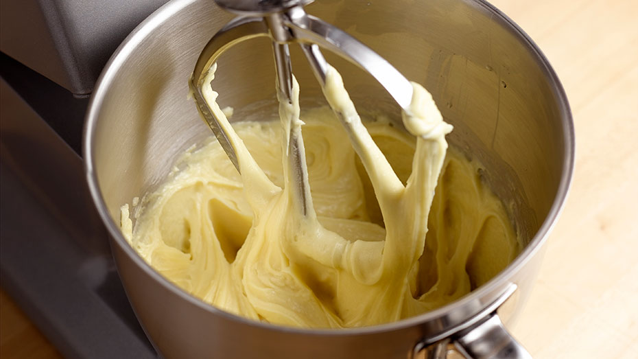 A mixer bowl filled with almond filling